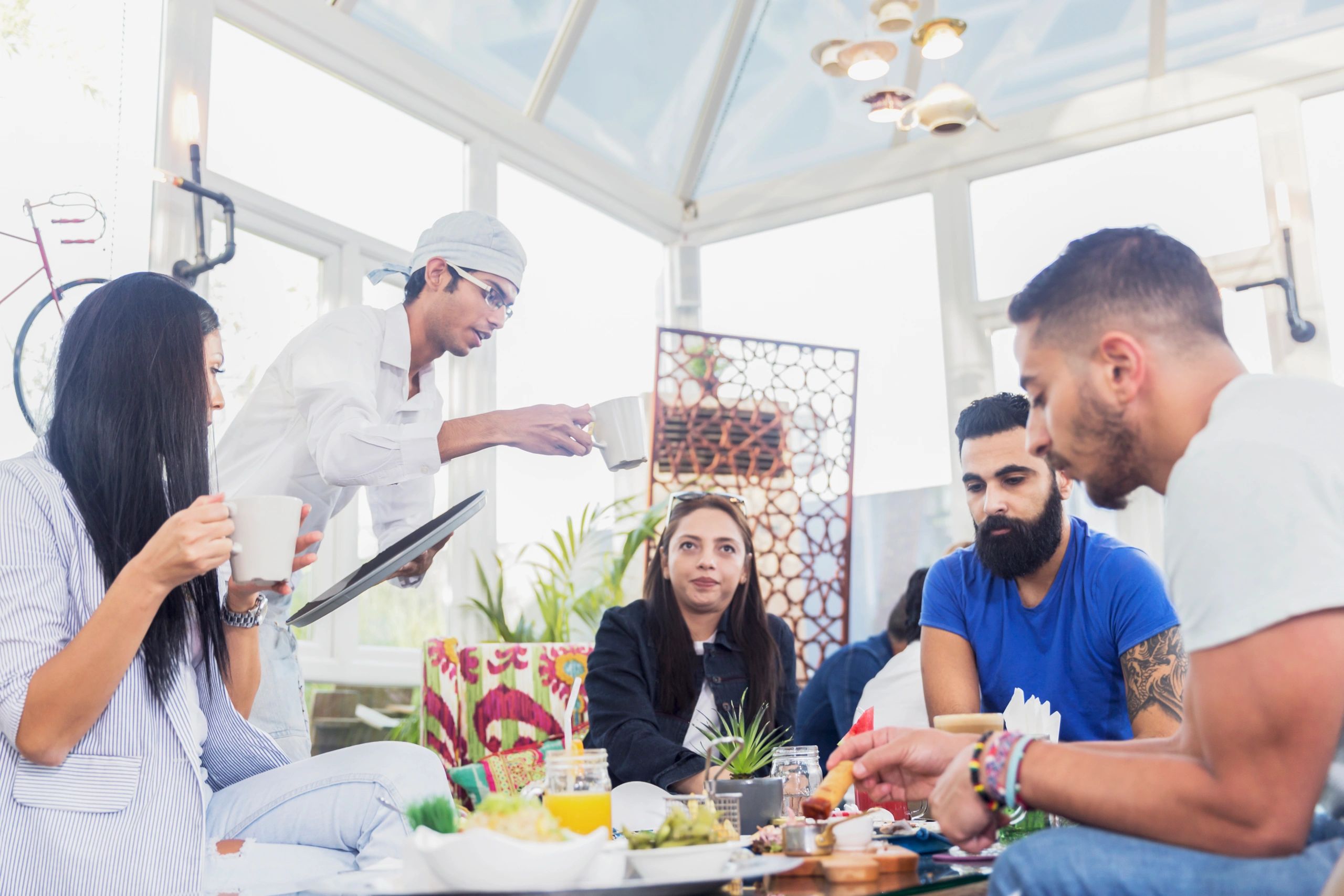Guests chatting at a corporate event with refreshments